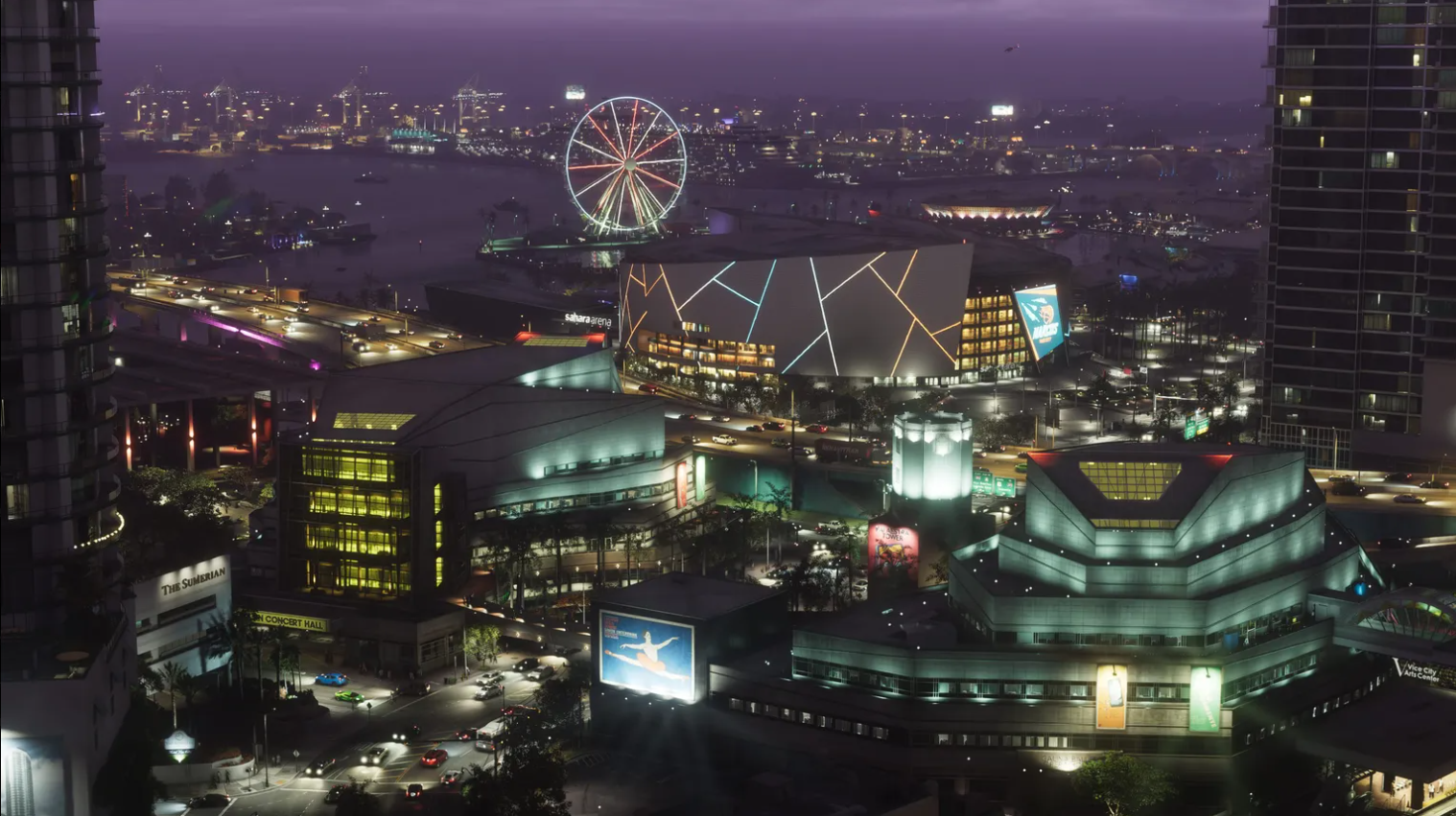 Aerial view of downtown Vice City at night, with the arena, waterfront and city lights